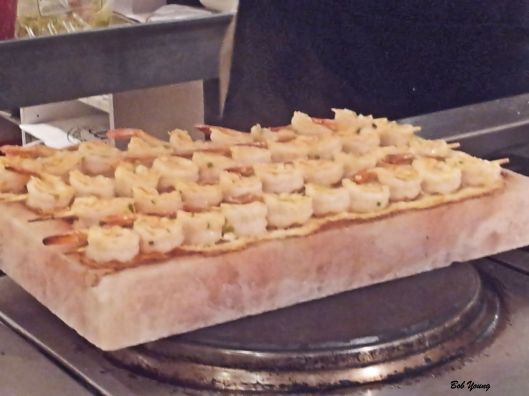 Cooking shrimp on a salt block. Personally, I think it is way too much salt.