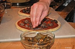 Prepping the Sausage and Pepper Pizza.