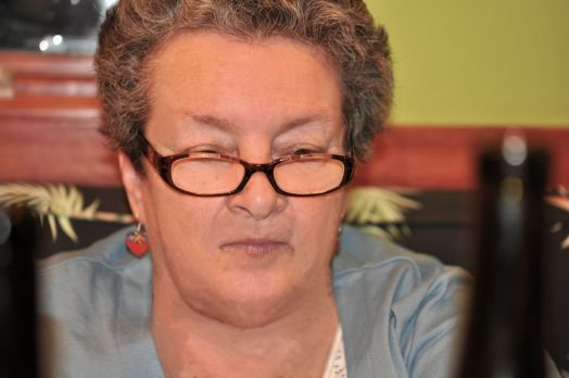 Robin is studying the wines and the dinner menu.