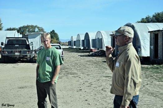 Tim Sommer and his son Mike, owners of the Purple Sage Farms, talk to the crowds that were there.ike3 loves to work on and with the  land. They use only their own compost and their water supply is from the Payette River. 