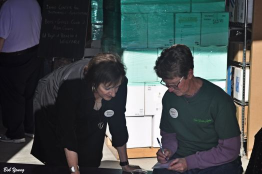 Karen Ellis and Janie Burns discuss the program for this afternoon.