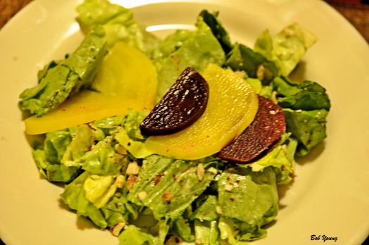 Salade de Bettraves et noisette Butter lettuce topped with gold and red beets, toasted hazelnuts and served with a mustard vinaigrette