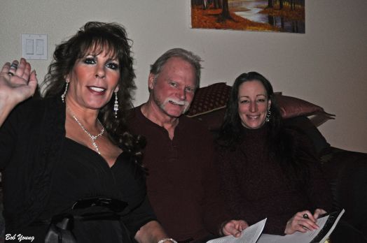 Kat, Rick and Tina are chatting on the couch.