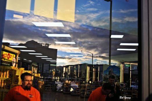 The rising sun brings activity to the store.