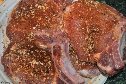 Bone-in pork chops getting happy with the Cajun Spice Blend that we make and which is also in the Recipe File above.