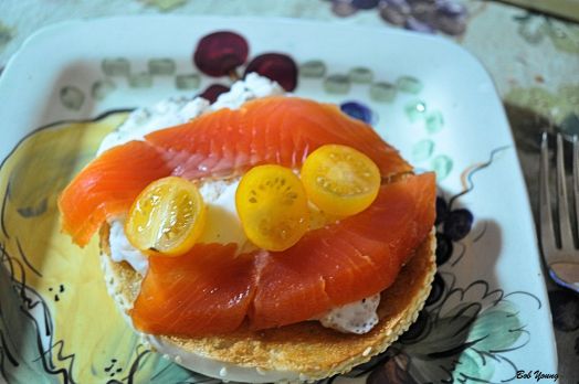 Poached Meadowlark Farm Egg Lox Heirloom Yellow Tomato on a Sesame Bagel