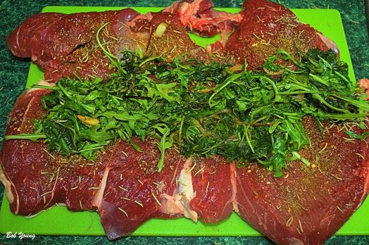 The boned leg of lamb with the stuffing in place. To bone the lamb, see the link above.