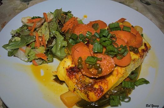 The halibut is being prepared for the packet.