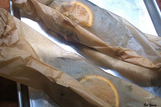 The trout is sealed in parchment. I folded the edges and then stapled them to hold the seal.