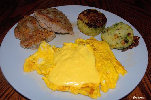 Two Meadowlark Farms Scrambled Eggs with Housemade Hollandaise Sauce Housemade Sausage Patties Broccoli and Potato Cakes