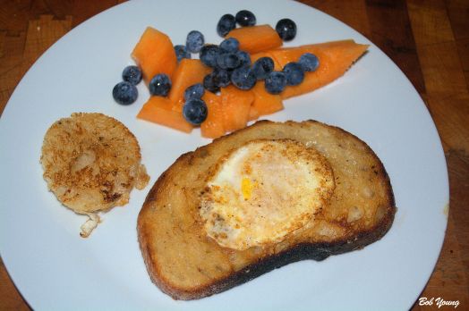 Cowboy Eggs (Eggs in Toast) Fresh Cantaloupe and Blueberries
