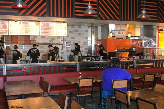 Some of the dining area with the pizza making area in the background. My one critisism of the dining area is that it is very "noisey". The sounds echo off of flat, hard surfaces which amplifies the sounds. They need some sound buffers.