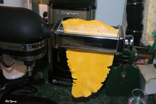 Start on setting 1 on your pasta machine. The one pictured here fits on our Kitchen Aid. But there are other mechanical ones the fit on a counter top. They both do the same thing, except the one for the mixer does not require hand turning, obviously.