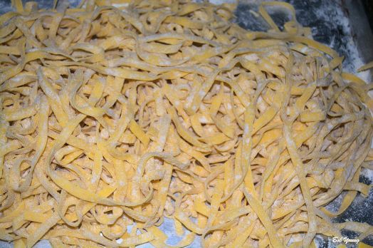 Fettuccine processed and floured to keep it from sticking.