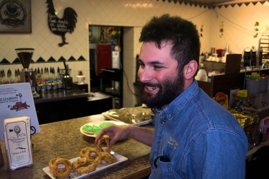 Patrick Williamson, Orchardist, explains to the Orchard House customer about the Williamson wines.