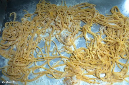 Spaghetti noodles from the dough. Dust with flour to keep them from sticking.