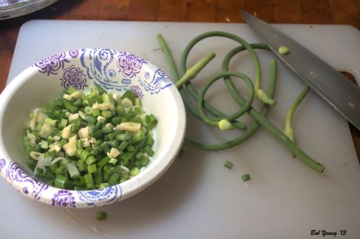 The Green Onion and Garlic have been diced. The garlic scapes are going to be diced.