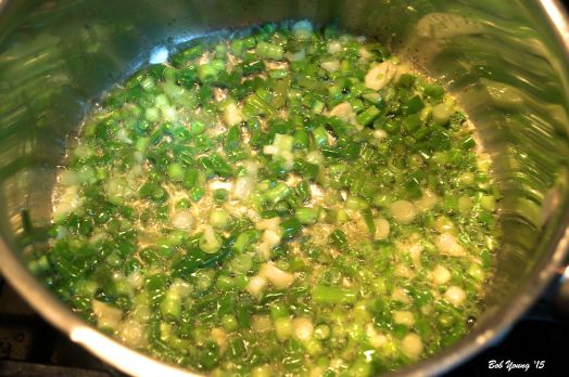 Cooking the green onion mixture.