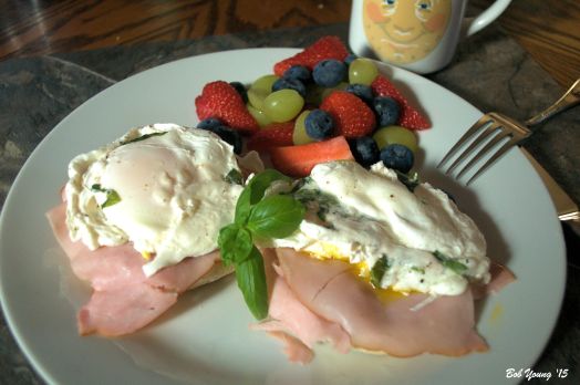 Poached Meadowlark Farms Eggs with Basil Black Forest Ham, Toasted English Muffin  Patriotic Fruit Mix