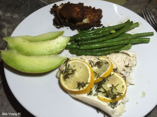 Flounder en Papillote Fresh Idaho Honeydew Melon Slices Potato Croquettes Fresh Green Beans with Brown Butter