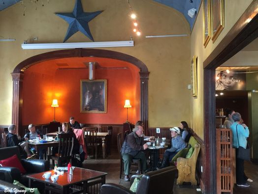 The dining area. Couches. Tables. Chairs. Pews. Oh yes! It once was a church. All ages are welcome - very young, children, old and very old!