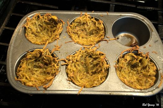 Shredded potatoes are placed in a muffin tin and cooked - browned - in a 350 degree F oven for about 25 minutes. Let cool before adding the eggs.