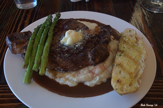 One-Inch Cut Char-Grilled Ribeye Steak - $16.95 Topped with Bleu Cheese Butter and accompanied by Rosemary Truffle Mashed Potatoes with Cabernet Beef Demi-Glace, Grilled Asparagus and Storm's Homemade Grilled Bread 