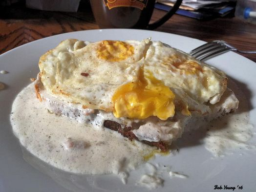 Sausage Gravy on Acme Sourdough Toast Over-Easy Egg
