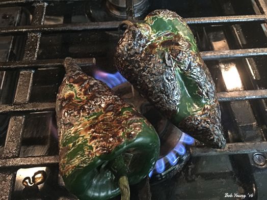 Roasting the poblanos on the gas stove.