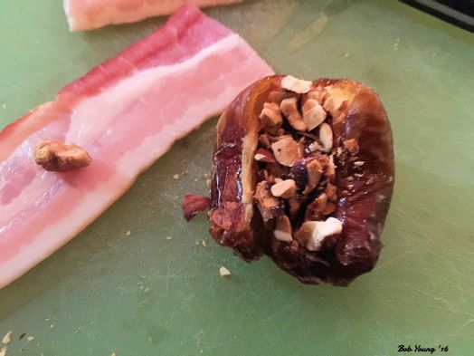 Getting the Bacon Wrapped Dates ready. Stuffed with Chopped Almond.