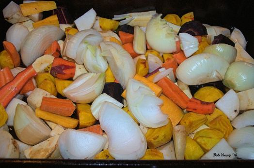 Root vegetables are large cut and put into the bottom of the baking pan. This roasts the vegetables and keeps the duck off of the pan surface.
