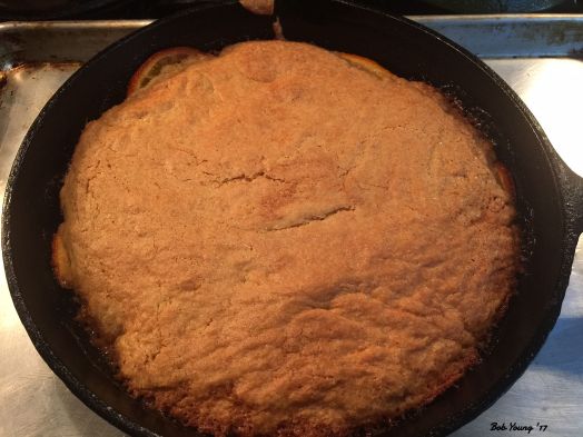 The cake is cooked and is now cooling before removing it from the skillet.