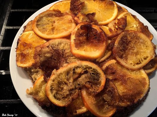 Put a platter over the skillet, turn it upside down and the cake should come out easily. If not, tap it lightly to encourage it.